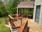 custom ipe deck project with gable roof deckorator spindles tigerwood rails